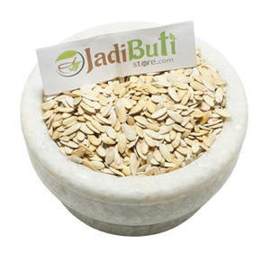 Kharbuja Beej pale flat muskmelon seeds with shell in a stone bowl — Jadibuti Store