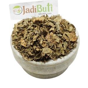Dried Mehndi Patta henna leaves in a bowl with a Jadibuti Store card