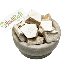 Vidari Kand dried root pieces in a stone bowl with Jadibuti Store card