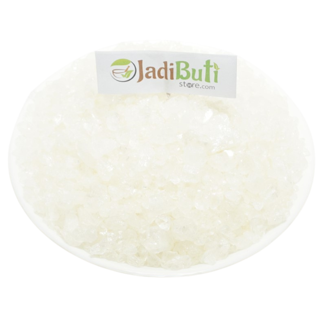 Ajwain Satva white translucent granules on a white plate — Jadibuti Store