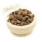Dried Amla fruit pieces in a stone bowl with Jadibuti Store card