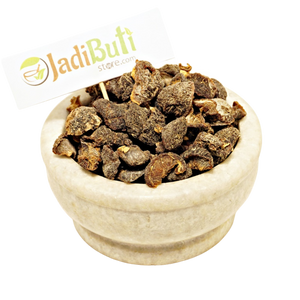 Dried Amla fruit pieces in a stone bowl with Jadibuti Store card