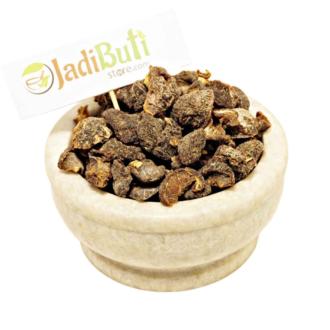 Dried Amla fruit pieces in a stone bowl with Jadibuti Store card