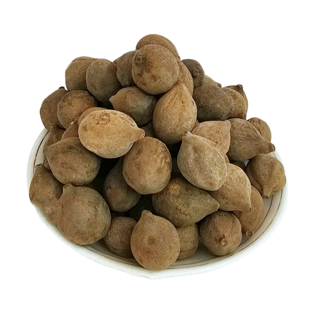 Baheda dried whole fruits on a white plate — Jadibuti Store