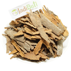 Dalchini irregular tan and brown cinnamon bark pieces on a white plate — Jadibuti Store