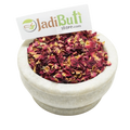Gulab Patti pink-red dried rose petal pieces in a stone bowl — Jadibuti Store