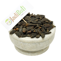 Natural Choti Harad Haritaki dark dried fruits in a stone bowl — Jadibuti Store
