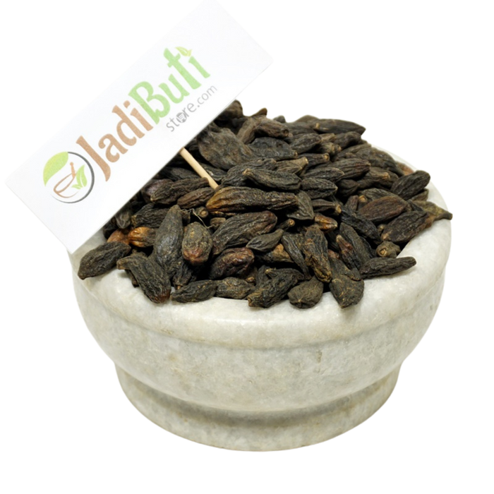 Natural Choti Harad Haritaki dark dried fruits in a stone bowl — Jadibuti Store