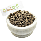 Kali Musli dark-brown cut rhizome pieces with pale cut surfaces in a stone bowl — Jadibuti Store