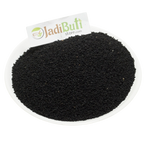 Kalonji whole black Nigella seeds on a white plate — Jadibuti Store