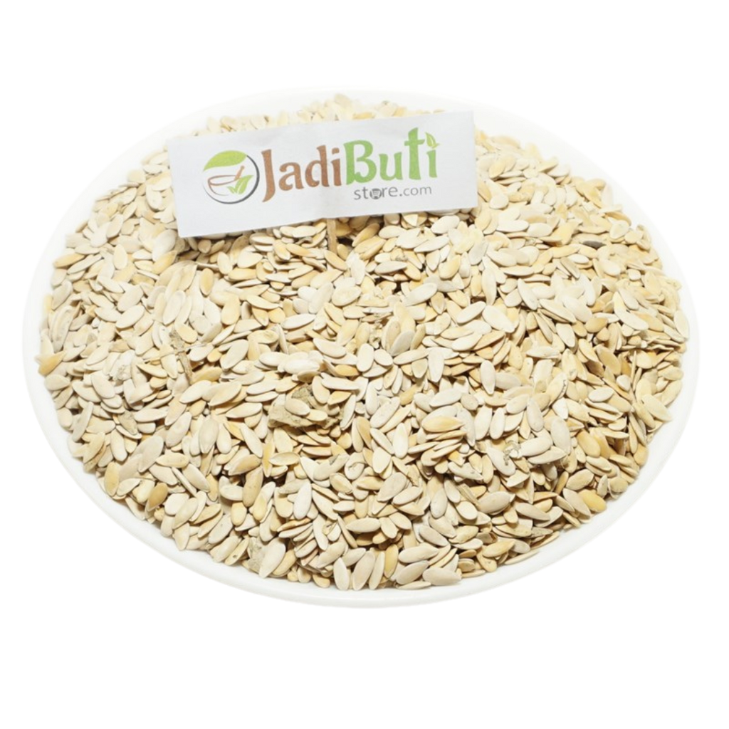 Kharbuja Beej pale flat muskmelon seeds with shell on a white plate — Jadibuti Store