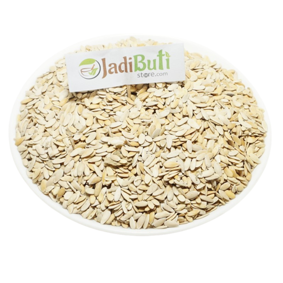 Kharbuja Beej pale flat muskmelon seeds with shell on a white plate — Jadibuti Store