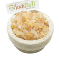Kikar Gond pale amber gum pieces in a stone bowl — Jadibuti Store