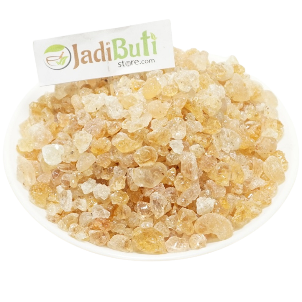 Kikar Gond pale amber gum pieces on a white plate — Jadibuti Store