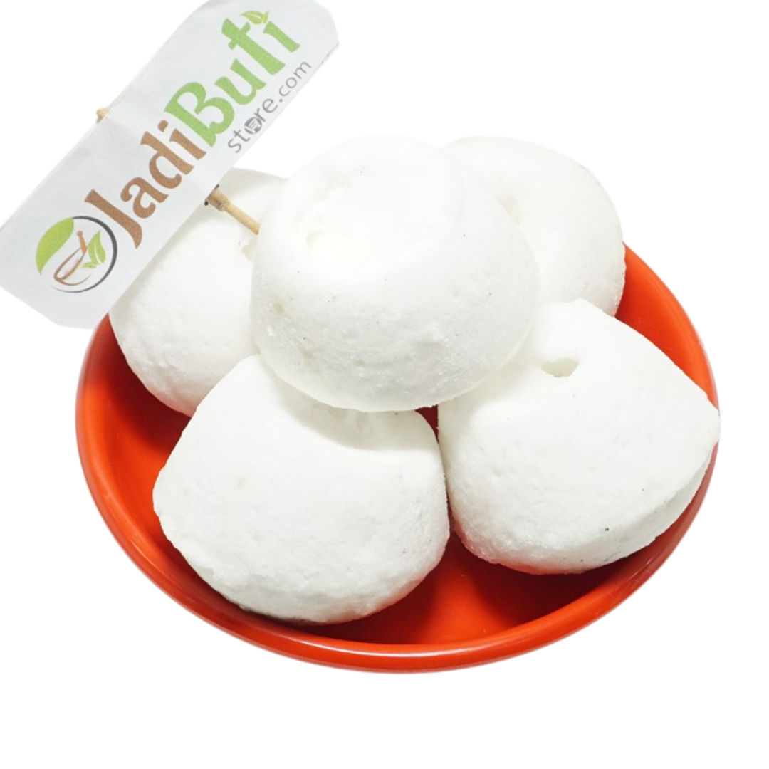 Kunja Mishri white rounded sugar-candy pieces in an orange bowl — Jadibuti Store