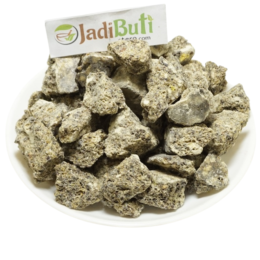 Loban irregular grey-beige aromatic resin chunks on a white plate — Jadibuti Store
