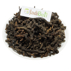 Nagarmotha dark brown dried rhizome material on a white plate — Jadibuti Store