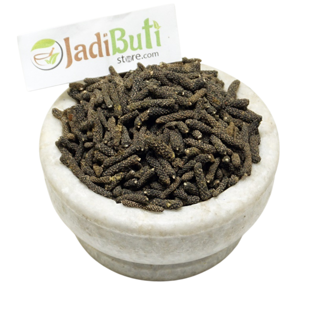 Pippali dried long-pepper fruiting spikes in a stone bowl — Jadibuti Store