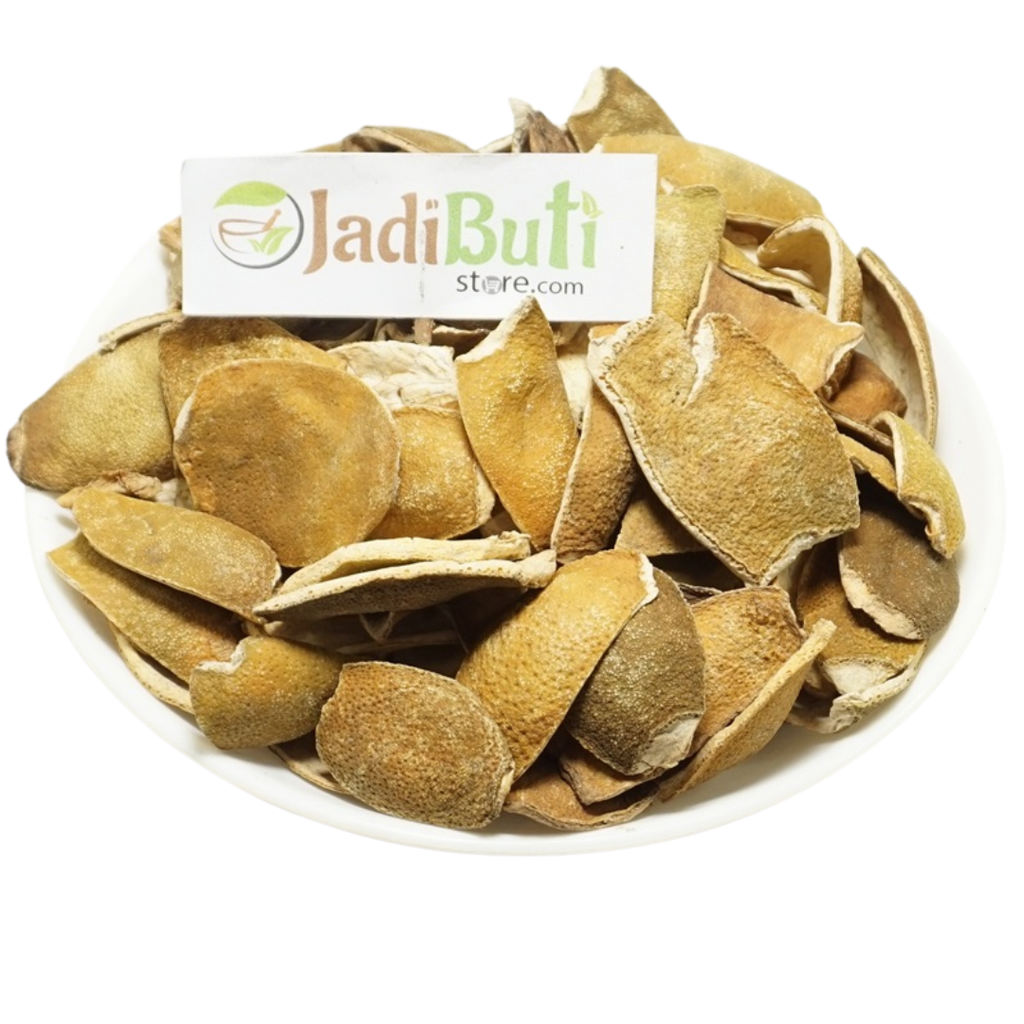 Natural dried Orange Peel / Santra Chilka pieces on a white plate — Jadibuti Store