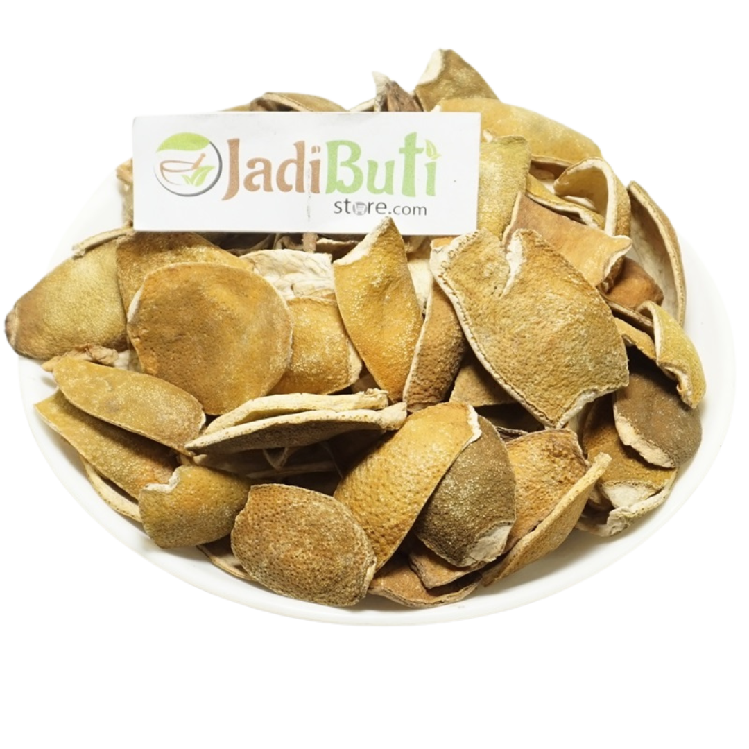 Natural dried Orange Peel / Santra Chilka pieces on a white plate — Jadibuti Store