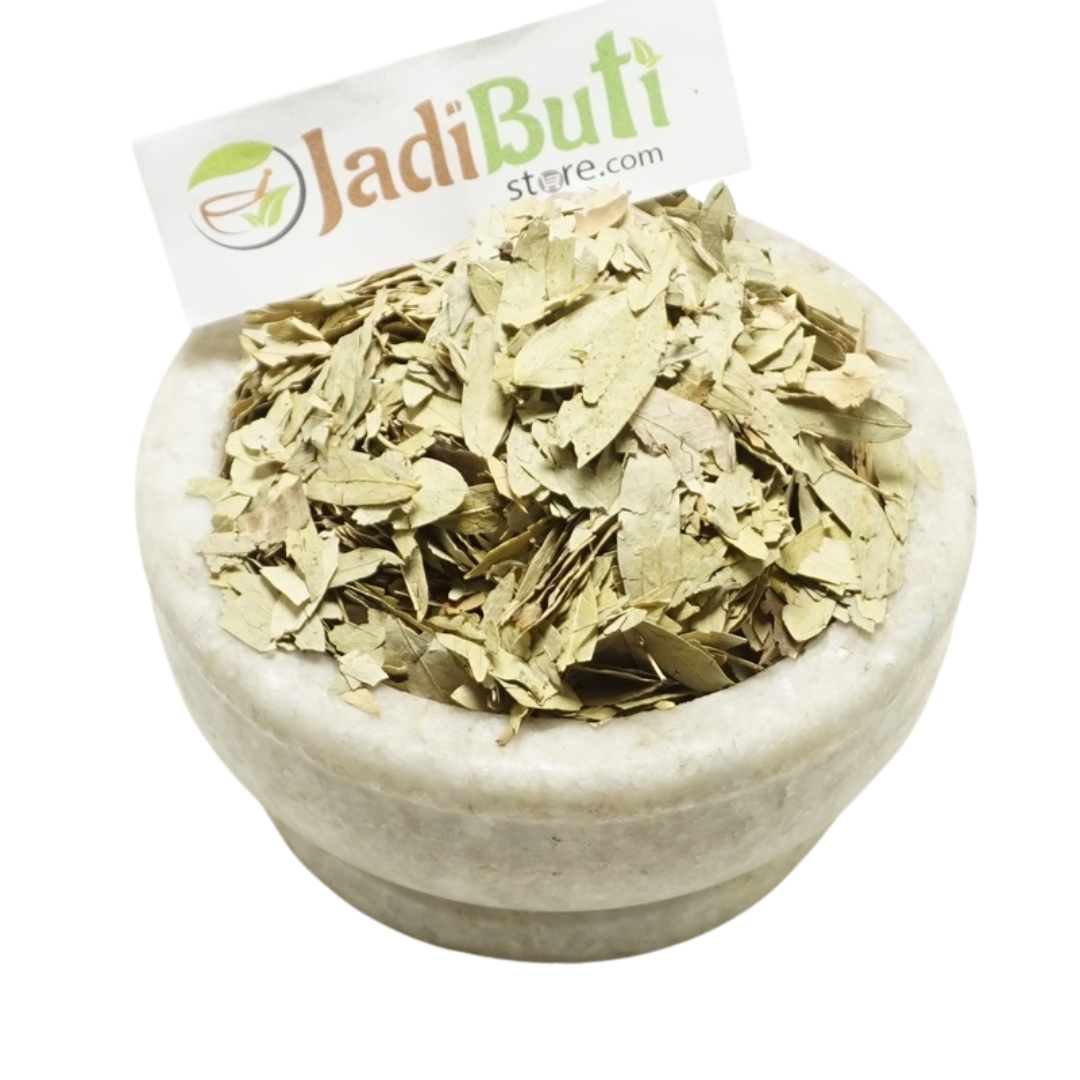Senna dried leaf pieces in a stone bowl with Jadibuti Store card