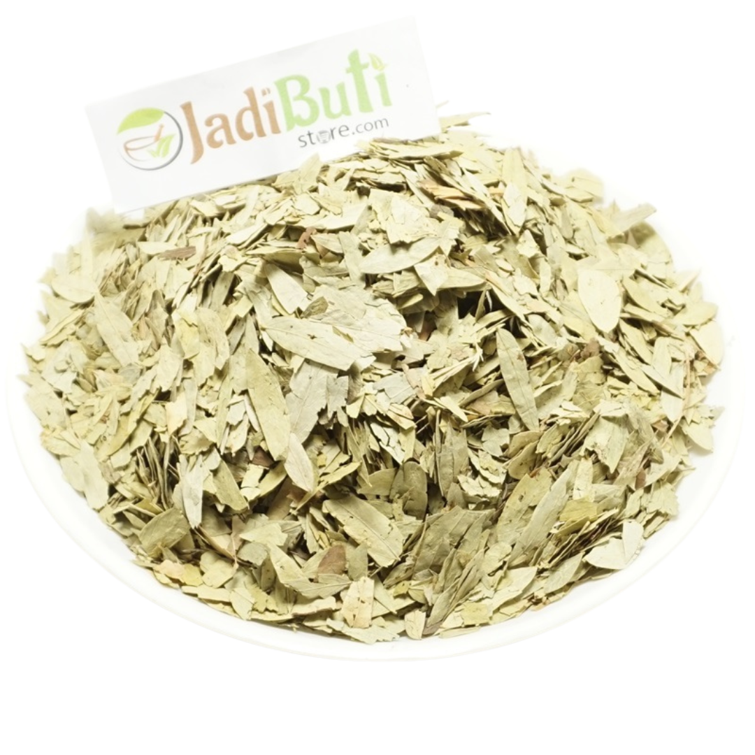 Senna dried leaf pieces on a white plate with Jadibuti Store card