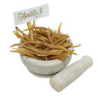 Shatavari dried roots in a mortar with pestle - Jadibuti Store