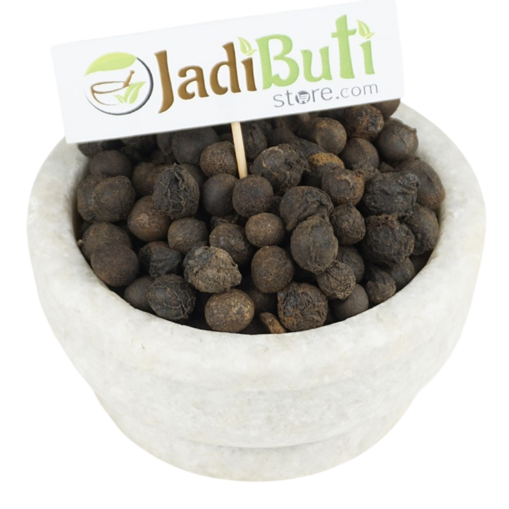 Sugandh Kokila dark rough rounded dried pieces in a stone bowl; species unverified — Jadibuti Store