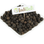 Sugandh Kokila dark rounded dried pieces on a white rectangular plate; species unverified — Jadibuti Store
