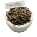 Tagar / Indian Valerian / तगर — dark brown rough underground pieces on a bowl