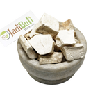 Vidari Kand dried root pieces in a stone bowl with Jadibuti Store card